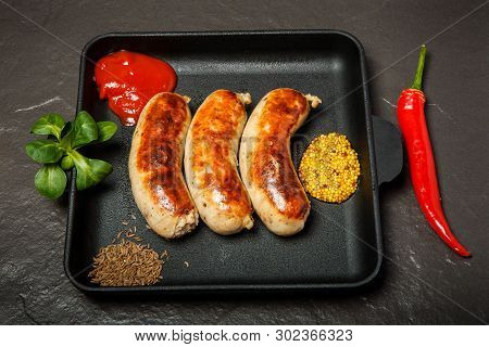 Top View Square Pan With Sausages And Granular Mustard