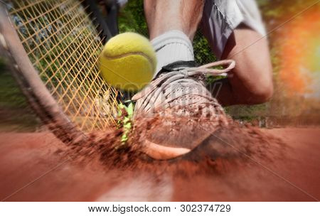 Tennis player on clay tennis court