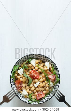 Fresh Organic Salad With Chickpeas, Arugula, Tomatoes, Rustick Table, White Background, Close Up