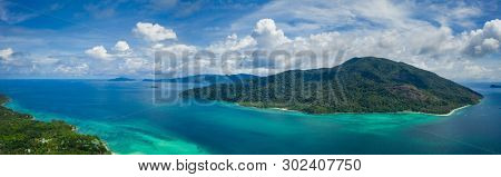Aerial drone view of beautiful green Koh Usen island with amazing lagoon sea over summer sky background, Thailand