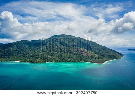 Aerial drone view of beautiful green Koh Usen island with amazing lagoon sea over summer sky background, Thailand