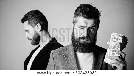 Scam And Deception. Man Bearded Fraudster Hold Cash Money While Victim Stand Sad Background. While N