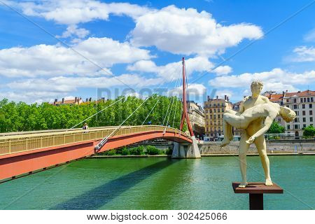 Lyon, France - May 10, 2019: The Saone River, The Weight Of Oneself Monument, With Locals And Visito
