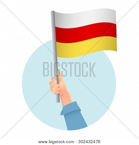 South Ossetia Flag In Hand. Patriotic Background. National Flag Of South Ossetia Vector Illustration