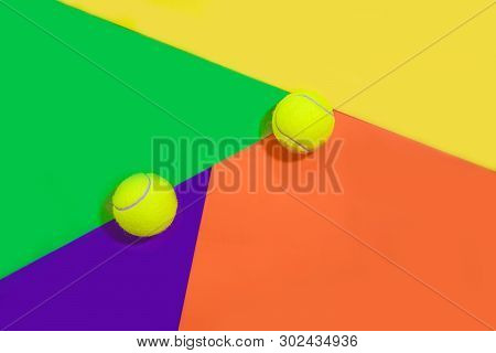 Tennis Layout With Tennis Balls On Abstract Different Multicolored Neon Background With Place For Te