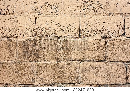 Brick Wall Fragment. Old Dirty Orange And Red Bricks With Defects. Grunge Texture With Cracks And We