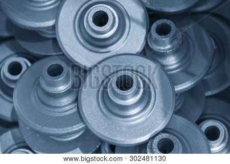 The Casting Iron Parts In The Light Blue Scene. The Products Of Die Casting Process.