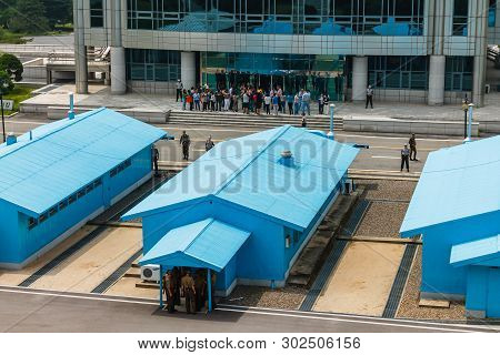 Panmunjom, North Korea - July 30, 2014: Border Between North And South Korea. Tourists From South Ko