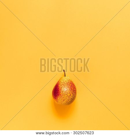 Yellow-red Pear On A Colored Background. Vitamins, Organic Products, Autumn Harvest, Vegetarianism, 