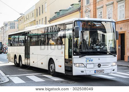 Salzburg, Austria - July 28, 2014: White Suburban Bus Mercedes-benz O550 Integro L In The City Stree