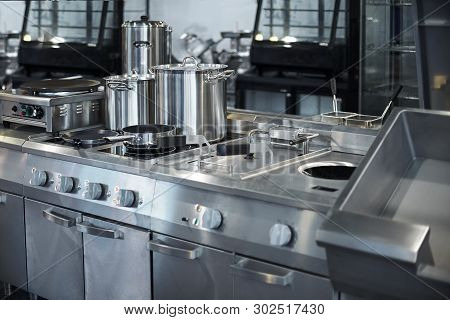 Work Surface And Kitchen Equipment In Professional Kitchen, View Counter In Stainless Steel.