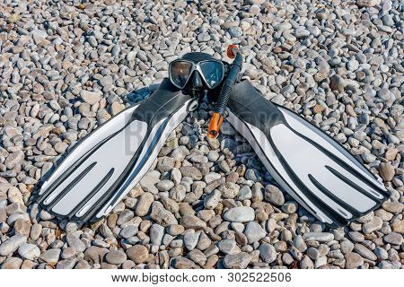 Diving Mask, A Snorkel And Swimfins On The Stonig Beach Of Adriatic Sea. Snorkel Equipment. Summer V