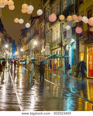 Porto, Portugal - November 21, 2016: Raining Evening At Santa Catarina Street, Paper Lanterns Decora