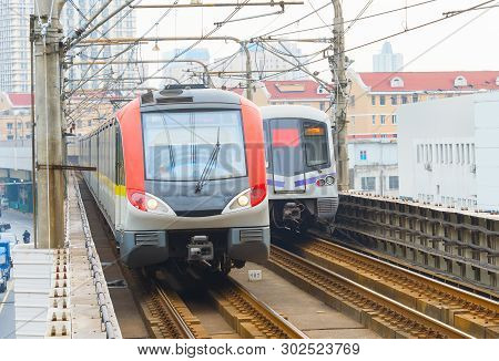 Shanghai Metro Train Leaving An Underground Station While Another Train Is Arriving. Shanghai , Chin