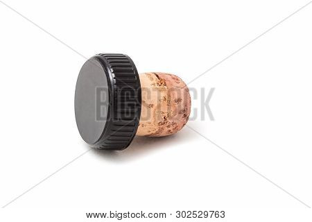 Cork For Wine With A Black Plastic Hat. Isolated On White Background.