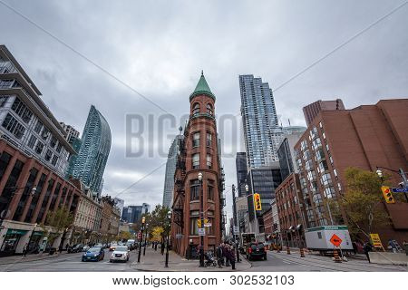 Toronto, Canada - November 13, 2018: Gooderham Building, On Wellington Street, Surrounded By Older B