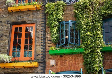Facade Detail In Covent Garden With Colorful Houses. It Contains Several Health Food Cafes And Value