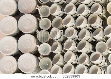 White Coffee Cups In Rows On Table. Cup Prepared For Hot Drink Such As Coffee Or Tea In Local Coffee