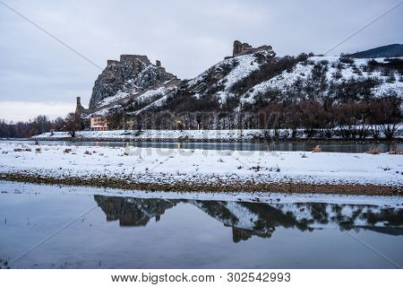 Snow Covered Devin Castle Ruins Above The Danube River In Bratislava, Slovakia In The Morning