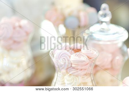 Delicious Fancy Fruit Pastils In Glass Jar. Beautiful Delicious Sweet Dessert On Blurred Background