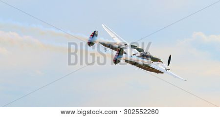 Pilsen / Czech Republic - September 9, 2018: Flying Bulls Red Bull sponsored Lockheed P-38 Lightning. Rare fighter plane over Pilsen.