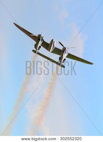 Pilsen / Czech Republic - September 9, 2018: Flying Bulls Red Bull sponsored Lockheed P-38 Lightning. Rare fighter plane over Pilsen.