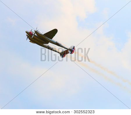 Pilsen / Czech Republic - September 9, 2018: Flying Bulls Red Bull sponsored Lockheed P-38 Lightning. Rare fighter plane over Pilsen.