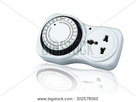 Plug-in Timer Mechanical 24 Hour. Indoor Home Tools. Plug-in Timer Socket Set Isolated On White Back