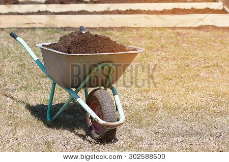 Garden Cart With Humus And Shovel Scoop