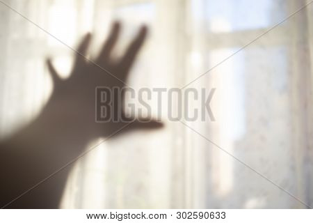 Hand Reaching For The Light. Soft Focus