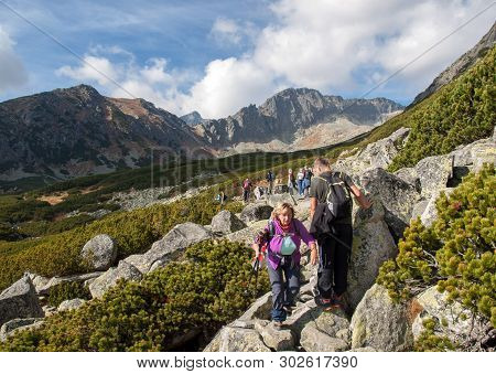 Vysoke Tatry, Slovakia - October 9, 2018: Hikers On Trail At Great Cold Valley,  Vysoke Tatry (high 