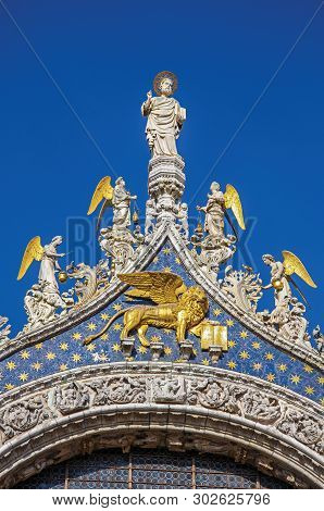 Close-up Of Sculptures And Frontispiece Made In Marble And Gold On The San Marco Basilica. At The Ci