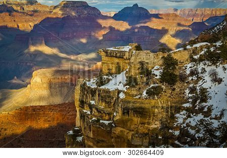 A View Of The Grand Canyon  With The Last Traces Of Winter Snow, From The South Rim, Arizona, Usa