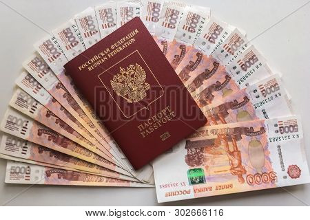 Russian Rubles Are On A Homogeneous Background, Bills Five Thousand Rubles, Money Fan In Hand