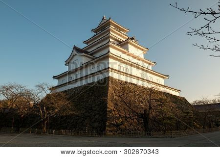 White Samurai Castle Of Japan In Evening Of Winter Season; Tsuruga Castle Is Historical Place In Aiz