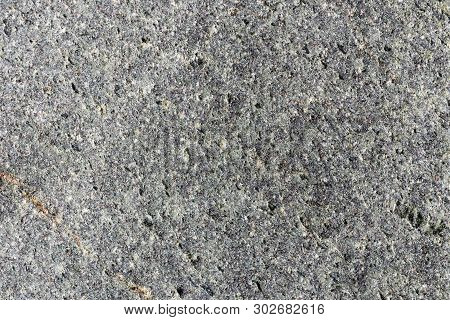 Closeup Macro View Of Grey Rough Stone Surface. Detailed Nature Pattern Texture Or Background Taken 