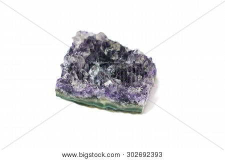 Natural Druse Of Purple Amethyst Crystal On A White Background. Isolated