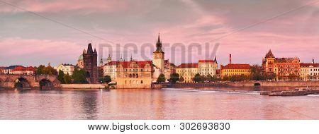 Prague, Panoramic Image Of The Riverside On Sunset. Charles Bridge, Novotnevo Lavka And Historic Bui
