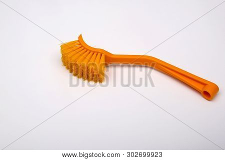 Massage Brush On A White Background. Orange Massage Brush. Cosmetics And Accessories For Bathrooms. 