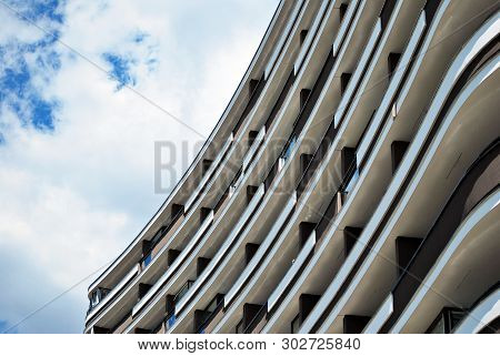 Modern Apartment Buildings On A Sunny Day With A Blue Sky. Facade Of A Modern Apartment Building