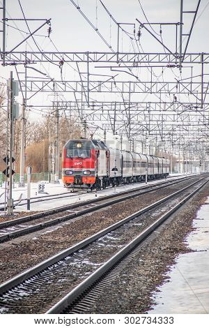 Russian Train. Locomotive With Cars. Passenger Train. . Russia Metallostroy March 8, 2019