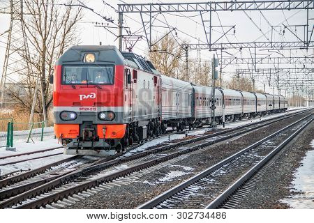 Russian Train. Locomotive With Cars. Passenger Train. . Russia Metallostroy March 8, 2019