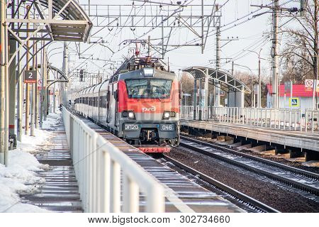 Russian Train. Locomotive With Cars. Passenger Train. . Russia Metallostroy March 8, 2019