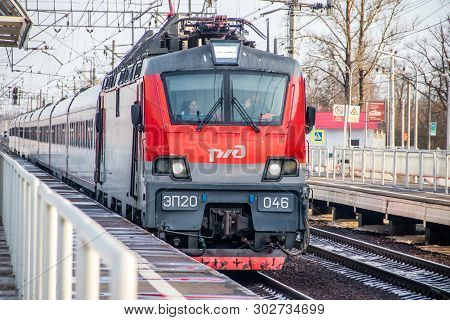 Russian Train. Locomotive With Cars. Passenger Train. . Russia Metallostroy March 8, 2019