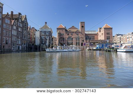 Amsterdam, Netherlands - July 02, 2018: View Of The Berlage Exchange Building On Damrak Street In Th