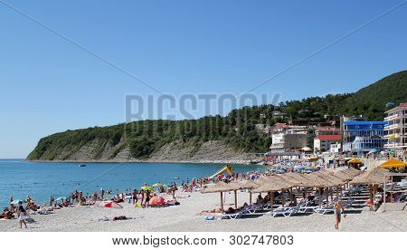 Olginka, Russia - May 24, 2019: Holidaymakers On The Beach, Olginka Village, Tuapse, The Black Sea, 