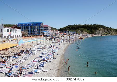 Olginka, Russia - May 24, 2019: Holidaymakers On The Beach, Olginka Village, Tuapse, The Black Sea, 