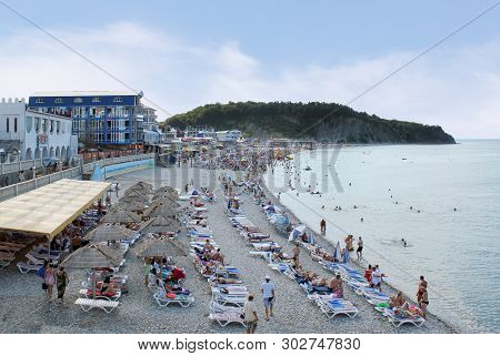 Olginka, Russia - May 24, 2019: Holidaymakers On The Beach, Olginka Village, Tuapse, The Black Sea, 
