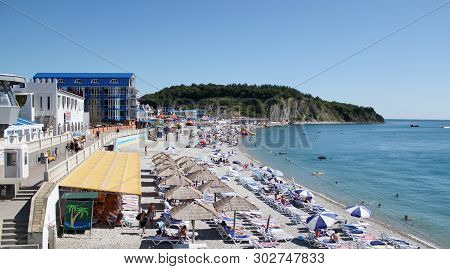 Olginka, Russia - May 24, 2019: Holidaymakers On The Beach, Olginka Village, Tuapse, The Black Sea, 