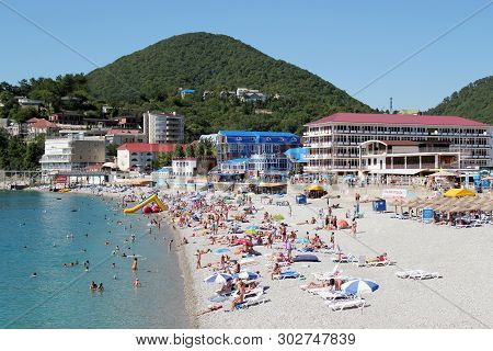 Olginka, Russia - May 24, 2019: Holidaymakers On The Beach, Olginka Village, Tuapse, The Black Sea, 